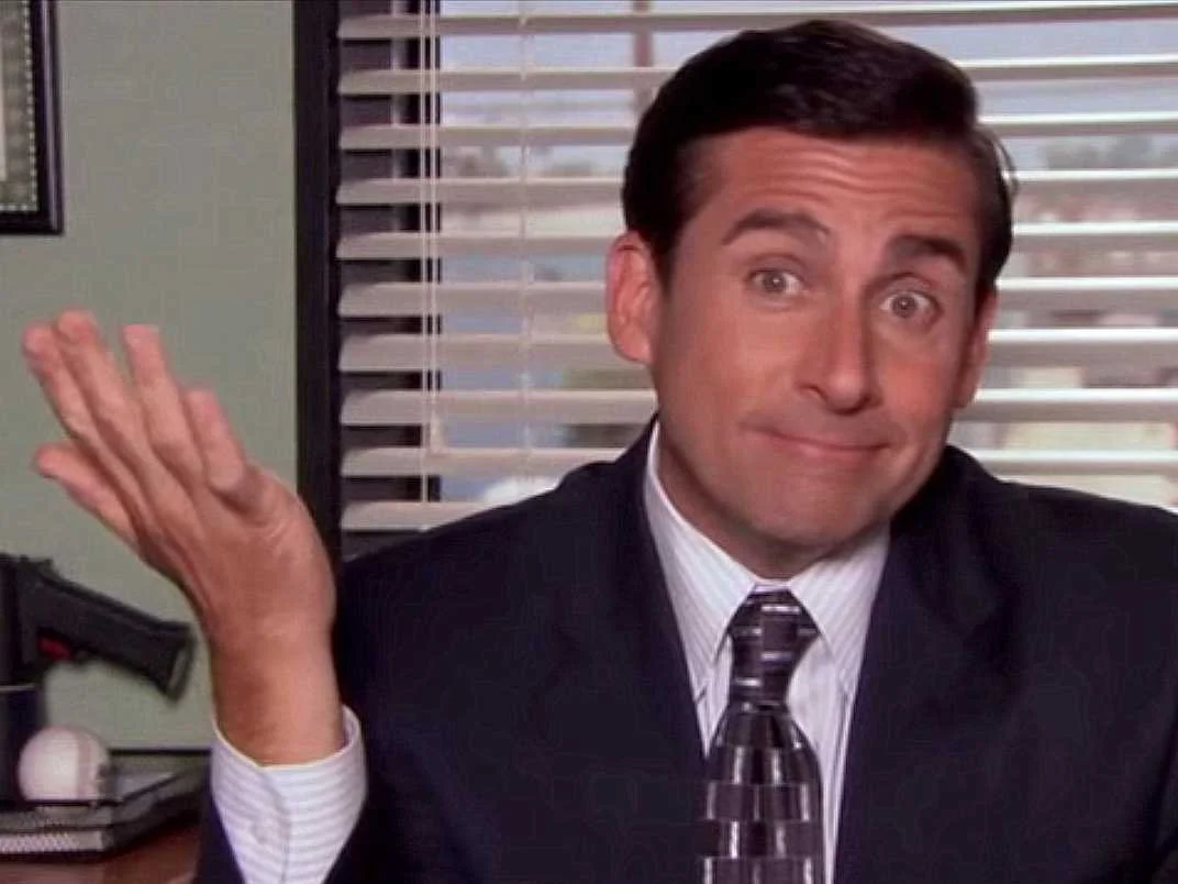 Micheal Scott from The Office shrugging.